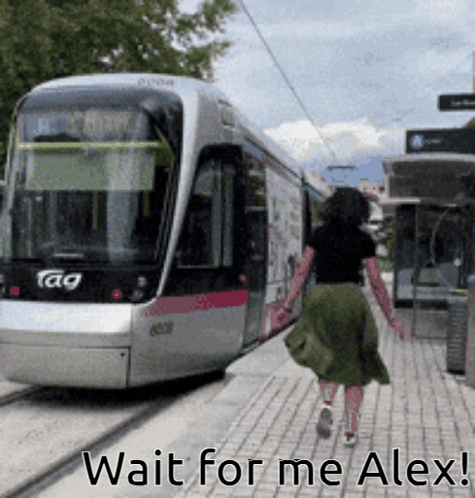 A Woman Walking Towards A Train With The Words Wait For Me Alex GIF