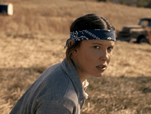 A Woman Wearing A Bandana That Says 000000 GIF
