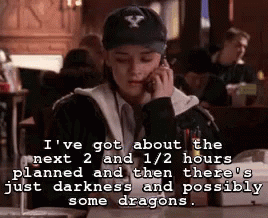 A Woman Wearing A Baseball Cap Is Talking On A Cell Phone In A Restaurant . GIF