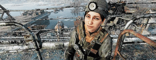 A Woman Wearing A Beanie And A Headlamp Is Sitting On A Railing . GIF