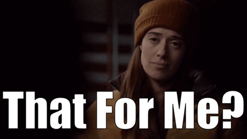 A Woman Wearing A Beanie And A Jacket Is Asking That For Me GIF