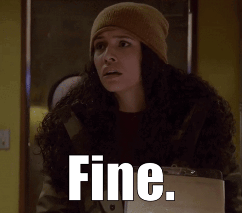 A Woman Wearing A Beanie And A Jacket With The Word Fine Written On It GIF