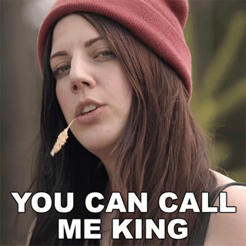 A Woman Wearing A Beanie Has A Flower In Her Mouth And Says You Can Call Me King GIF