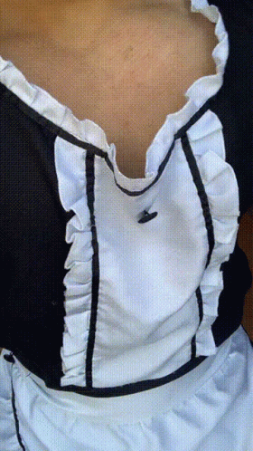 A Woman Wearing A Black And White Maid Dress GIF