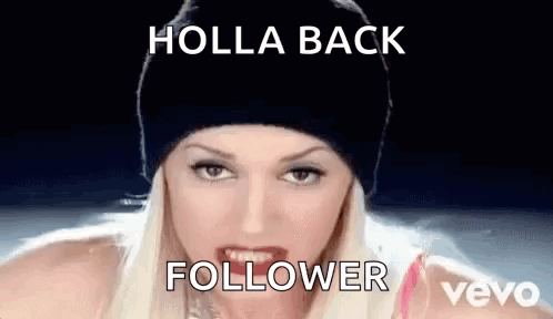 A Woman Wearing A Black Beanie Is Making A Funny Face With The Words Holla Back Follower Written On The Bottom . GIF