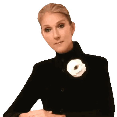 a woman wearing a black coat with a white flower on her collar