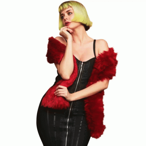 A Woman Wearing A Black Hat And A Red Furry Scarf GIF