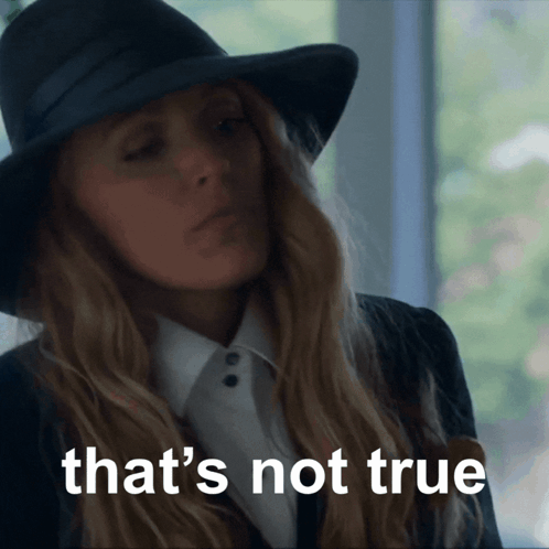 A Woman Wearing A Black Hat And A White Shirt Says That 'S Not True GIF