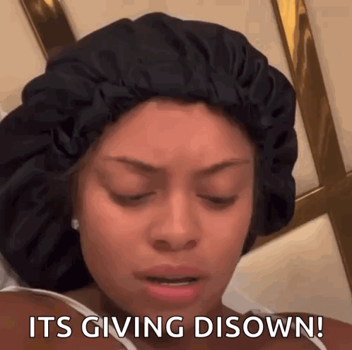 A Woman Wearing A Black Hat Says It 'S Giving Disown ! GIF
