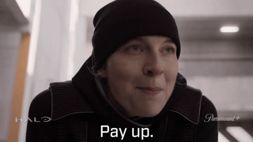 A Woman Wearing A Black Hat Says Pay Up In A Halo Advertisement GIF