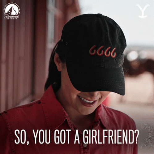 A Woman Wearing A Black Hat With 666 On It GIF