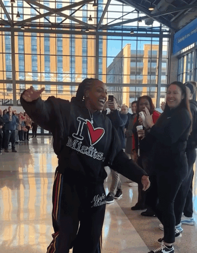 A Woman Wearing A Black Hoodie That Says I Love Misfits GIF