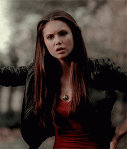 A Woman Wearing A Black Jacket And A Red Shirt GIF