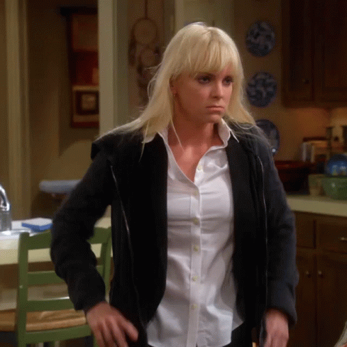 A Woman Wearing A Black Jacket And A White Shirt GIF