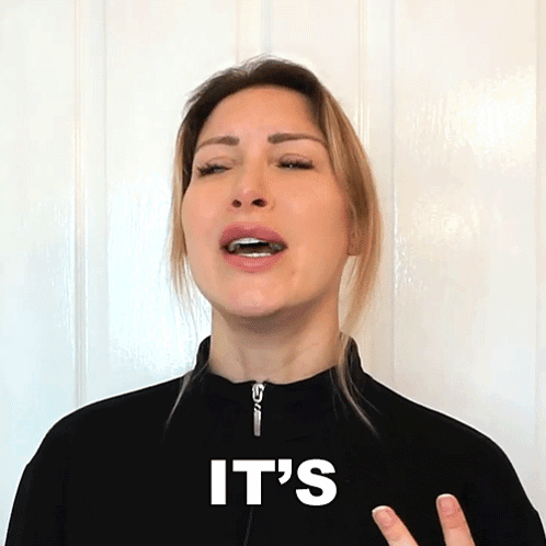 A Woman Wearing A Black Jacket With The Word It 'S On It GIF