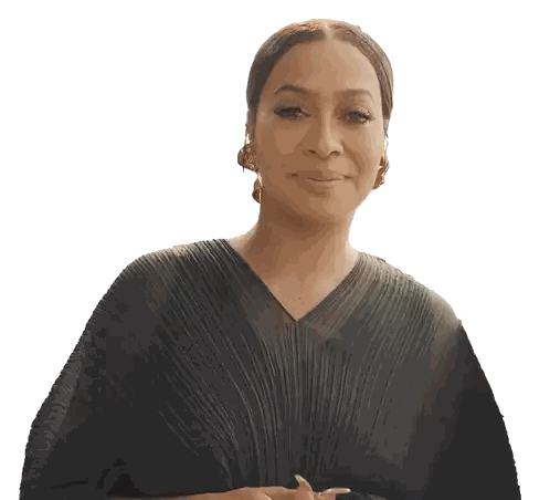 a woman wearing a black pleated dress and gold earrings