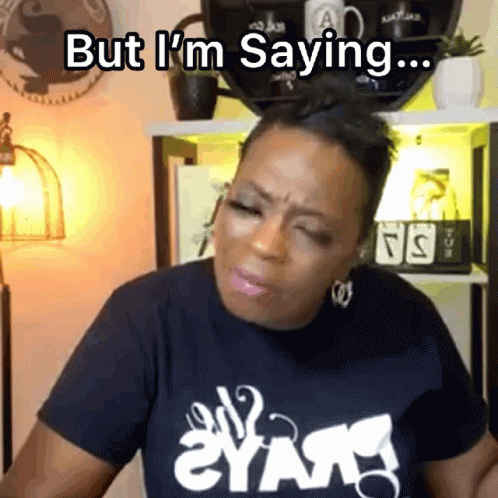 A Woman Wearing A Black Shirt That Says " But I 'M Saying " On It GIF