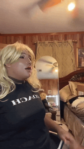 A Woman Wearing A Black Shirt That Says Hoao On It GIF