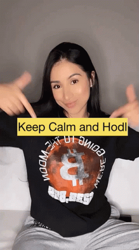 A Woman Wearing A Black Shirt That Says " Keep Calm And Hodl " GIF