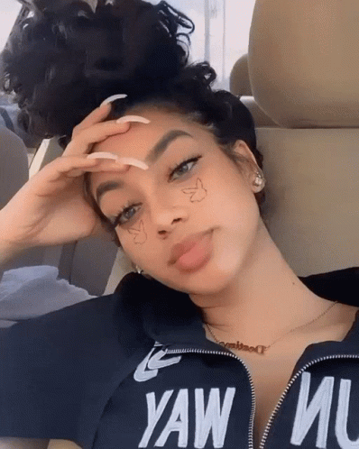 A Woman Wearing A Black Shirt That Says Yaw Mu On It GIF
