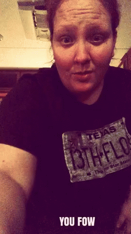 A Woman Wearing A Black Shirt With A Texas License Plate GIF