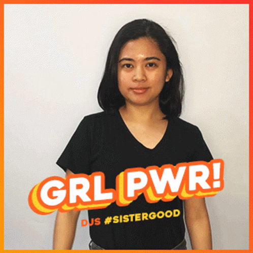 A Woman Wearing A Black Shirt With Grl Pwr Written On It GIF