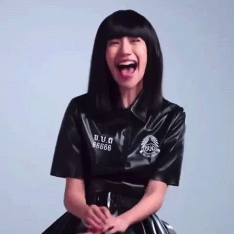 A Woman Wearing A Black Shirt With The Number 66666 On The Sleeve GIF