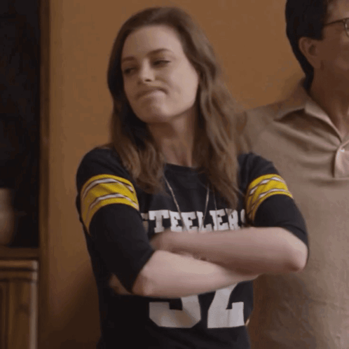 A Woman Wearing A Black Steelers Shirt With The Number 34 On It GIF