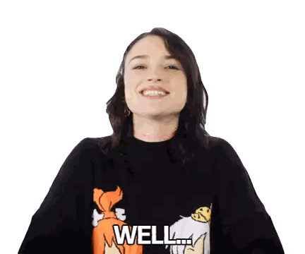 a woman wearing a black sweater that says well on it