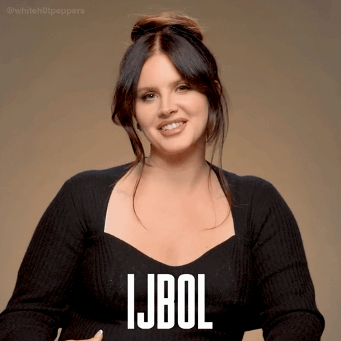 a woman wearing a black sweater with the word ljbol written on it
