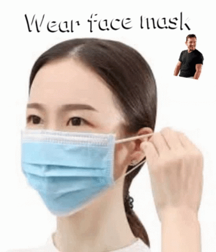 A Woman Wearing A Blue Face Mask With A Man Standing Behind Her . GIF