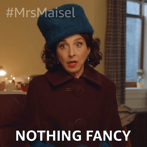 A Woman Wearing A Blue Hat And Gloves Says " Nothing Fancy " GIF
