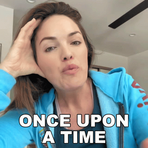 A Woman Wearing A Blue Hoodie With The Words Once Upon A Time On It GIF