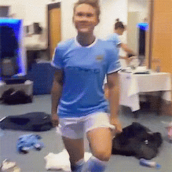 A Woman Wearing A Blue Shirt That Says City On It GIF