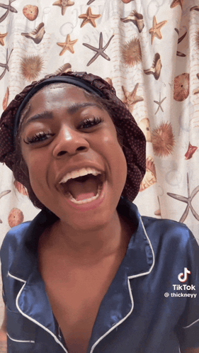 A Woman Wearing A Blue Shirt That Says Thickneyy On It GIF