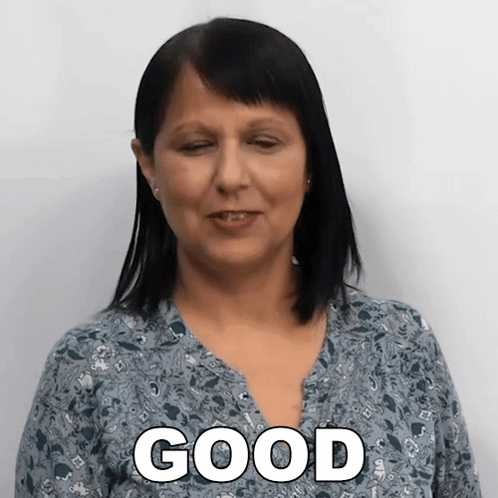 A Woman Wearing A Blue Shirt With The Word Good On It GIF