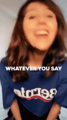 A Woman Wearing A Blue T-Shirt That Says Whatever You Say GIF