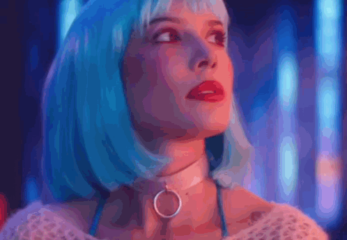 A Woman Wearing A Blue Wig And A Choker Is Looking Up At The Sky . GIF