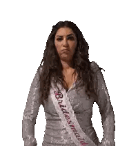 a woman wearing a bridesmaid sash is standing with her hands on her hips
