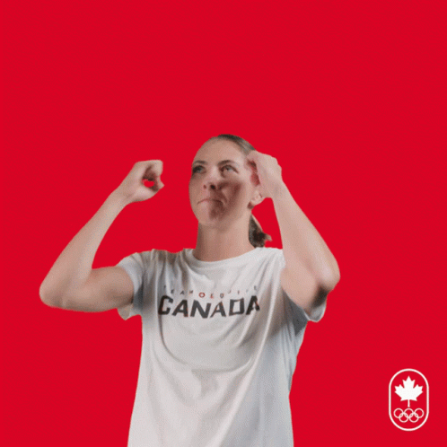 A Woman Wearing A Canada T-Shirt Has Her Hands Up In The Air GIF