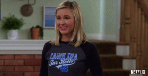 Woman In Carolina Tar Heels Shirt Smiling GIF