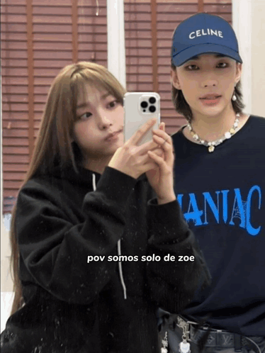 A Woman Wearing A Celine Hat Takes A Picture Of Herself GIF