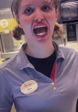 A Woman Wearing A Chick-Fil-A Shirt Has A Name Tag That Says Gina GIF