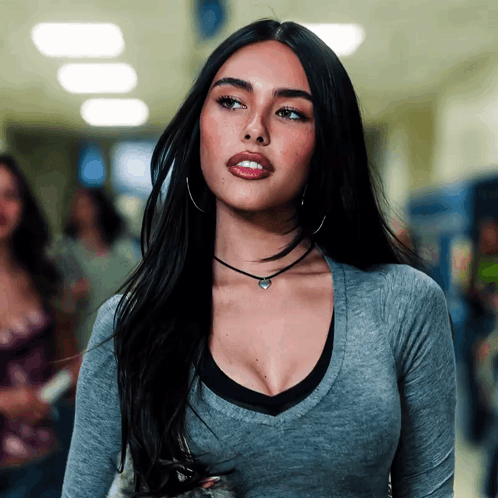 A Woman Wearing A Choker And Hoop Earrings Looks To The Side GIF