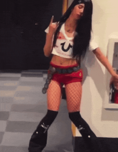 A Woman Wearing A Crop Top With A Letter U On It GIF