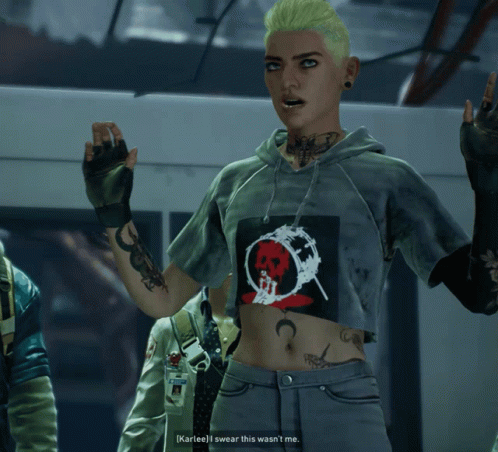 A Woman Wearing A Crop Top With A Skull On It GIF