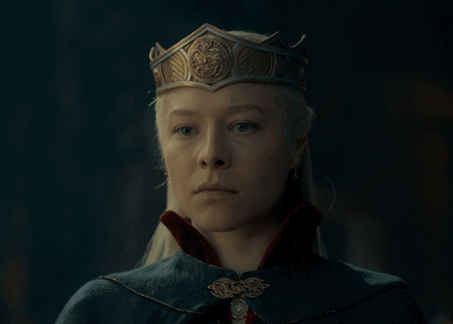 A Woman Wearing A Crown And A Cape GIF
