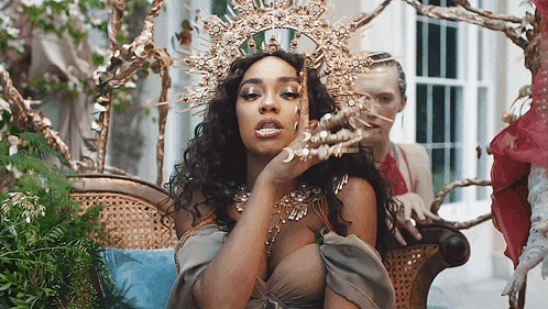 Woman Wearing Crown Sitting On Chair GIF