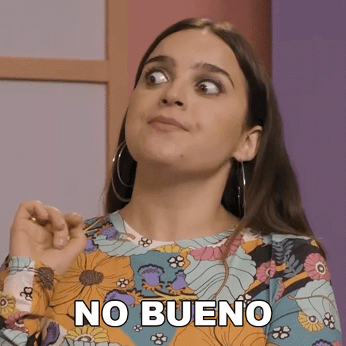 A Woman Wearing A Floral Shirt Has The Word No Bueno On Her Face GIF