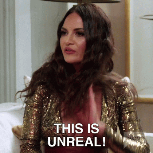 A Woman Wearing A Gold Sequined Jacket Says This Is Unreal GIF